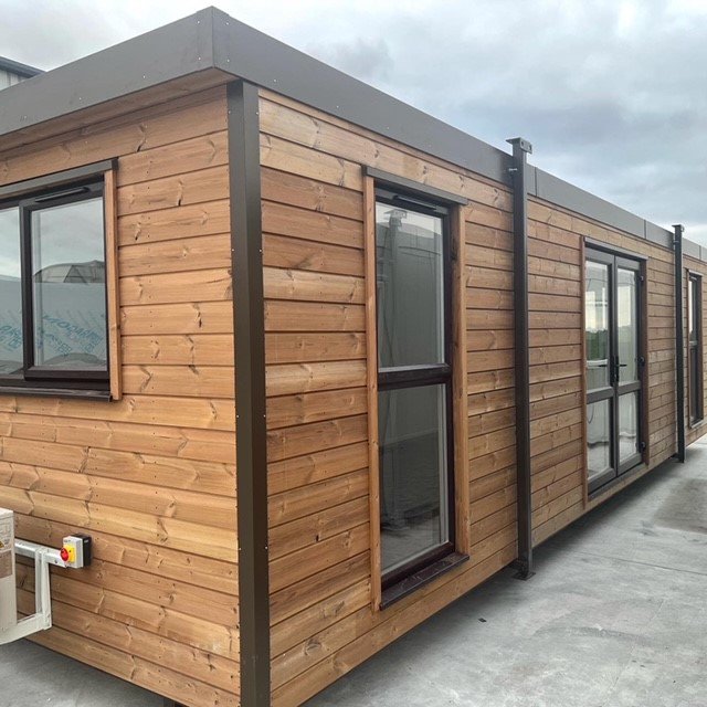 Portable cabin with external timber cladding.