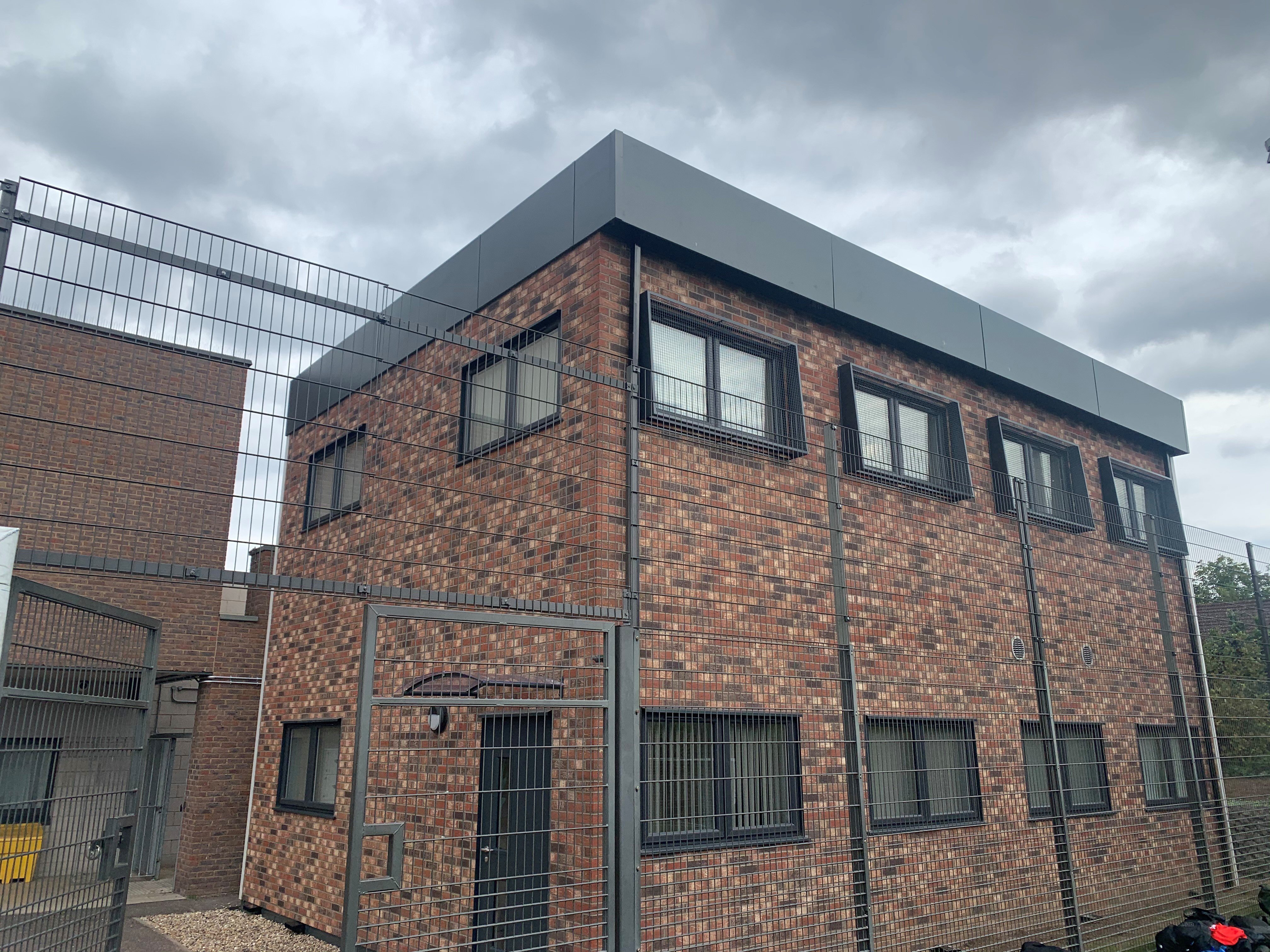 Two storey modular building with external brick cladding.